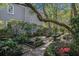 Lush backyard with manicured gardens and a stone walkway at 82 Ponsbury Rd, Mount Pleasant, SC 29464
