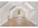 This bedroom features light-colored wood floors, a skylight, and a small window at 82 Ponsbury Rd, Mount Pleasant, SC 29464