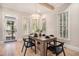 Bright dining room featuring a modern chandelier and hardwood floors at 82 Ponsbury Rd, Mount Pleasant, SC 29464