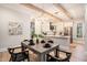Open-concept dining area with stylish lighting, hardwood floors and views of the kitchen at 82 Ponsbury Rd, Mount Pleasant, SC 29464