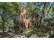 Two-story home with charming architectural details, including a quaint covered balcony at 82 Ponsbury Rd, Mount Pleasant, SC 29464