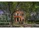 Charming two-story home with wood siding, a covered balcony, and lush landscaping at 82 Ponsbury Rd, Mount Pleasant, SC 29464