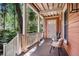 Inviting front porch with chairs, wood floors, railing, and natural light at 82 Ponsbury Rd, Mount Pleasant, SC 29464