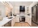 Modern kitchen with white cabinets, stainless steel appliances, and a breakfast bar at 82 Ponsbury Rd, Mount Pleasant, SC 29464