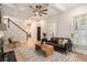 Inviting living area with a fireplace, hardwood floors, and staircase at 82 Ponsbury Rd, Mount Pleasant, SC 29464