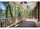Spacious porch featuring wooden railing, posts and ceiling fans at 82 Ponsbury Rd, Mount Pleasant, SC 29464