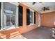 Porch featuring dark shutters, ceiling fans, and wood flooring at 82 Ponsbury Rd, Mount Pleasant, SC 29464