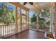Relaxing screened porch with wood flooring and an outdoor view at 82 Ponsbury Rd, Mount Pleasant, SC 29464