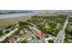 Aerial view of a multi-Gathering residential community with a pool and marsh views in the background at 867 Colony Dr # F92, Charleston, SC 29407