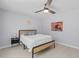 Inviting bedroom with ceiling fan, neutral walls, light flooring, and a comfortable bed with stylish decor at 867 Colony Dr # F92, Charleston, SC 29407
