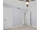 Bright bedroom with a ceiling fan, light wood flooring, closet, and open doorway at 867 Colony Dr # F92, Charleston, SC 29407