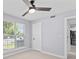Well-lit room with ceiling fan, light wood flooring, a window with blinds and a closet at 867 Colony Dr # F92, Charleston, SC 29407