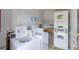 Shared laundry room featuring multiple washers and dryers for residents' convenience at 867 Colony Dr # F92, Charleston, SC 29407
