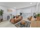 Bright living room featuring a comfortable brown sofa, stylish rug, and hardwood floors at 867 Colony Dr # F92, Charleston, SC 29407