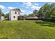 Spacious backyard with vibrant green grass and screened-in porch at 8987 Planters Row Ln, Summerville, SC 29485