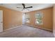 Cozy bedroom featuring plush carpeting, a ceiling fan, and great natural light at 8987 Planters Row Ln, Summerville, SC 29485