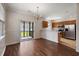 Dining and kitchen area with chandelier, stainless steel appliances, and lots of light at 8987 Planters Row Ln, Summerville, SC 29485