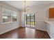 Inviting dining area with chandelier, sliding glass door, and ample natural light at 8987 Planters Row Ln, Summerville, SC 29485