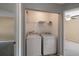 Convenient laundry closet with washer, dryer, and shelving at 8987 Planters Row Ln, Summerville, SC 29485