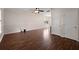 Spacious living room with beautiful wood floors, neutral walls, and ample natural light at 8987 Planters Row Ln, Summerville, SC 29485