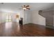 Living area featuring hardwood floors, a ceiling fan, and open access to the kitchen at 8987 Planters Row Ln, Summerville, SC 29485