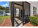 Home's screened-in porch overlooks backyard with tidy landscaping at 8987 Planters Row Ln, Summerville, SC 29485