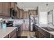 Kitchen with stainless steel appliances, dark cabinets, and modern countertops at 9009 Chato Ct, Summerville, SC 29483