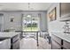 Bright kitchen with a view of the backyard and a large wooden table at 9009 Chato Ct, Summerville, SC 29483
