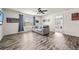 Comfortable living room with hardwood floors, large windows, and ceiling fan at 9009 Chato Ct, Summerville, SC 29483