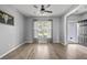 Bright living room with gray walls, wood floors, natural light, and neutral tones at 9009 Chato Ct, Summerville, SC 29483