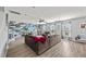 Spacious living room with a large sofa, statement wall, and plenty of natural light at 9009 Chato Ct, Summerville, SC 29483