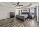 Spacious main bedroom features hardwood floors, ceiling fan and natural light at 9009 Chato Ct, Summerville, SC 29483