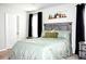 Comfortable bedroom with modern decor, a large window, and a soothing color palette at 9694 Roseberry St, Ladson, SC 29456