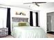 Cozy bedroom featuring a queen bed, side tables, and a serene ambiance at 9694 Roseberry St, Ladson, SC 29456