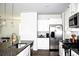 Bright kitchen featuring granite countertops, stainless steel appliances, and ample cabinet space at 9694 Roseberry St, Ladson, SC 29456