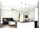 Bright living area seamlessly connects to the kitchen, creating a welcoming and spacious feel at 9694 Roseberry St, Ladson, SC 29456