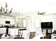 Bright, open-concept living space with hardwood floors, stylish lighting, and modern decor at 9694 Roseberry St, Ladson, SC 29456