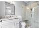Modern bathroom featuring a glass enclosed shower and granite-topped vanity with bright lighting at 6 Kirkland Ln, Charleston, SC 29401