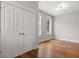 Bedroom featuring neutral walls, wood floors, and a closet with double doors at 6 Kirkland Ln, Charleston, SC 29401