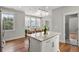 Kitchen boasts an island and an attached sunroom with large windows for ample lighting at 6 Kirkland Ln, Charleston, SC 29401