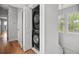 Laundry room features stacked washer and dryer and natural light from the adjacent window at 6 Kirkland Ln, Charleston, SC 29401