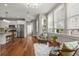 Bright living room with hardwood floors, modern lighting, and a stainless steel refrigerator in view at 6 Kirkland Ln, Charleston, SC 29401