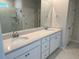 Bathroom featuring a double sink vanity, marble counters, and a large framed mirror at 1035 Tulip Shell St, Summerville, SC 29485