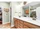 A spacious bathroom features double sinks, wood cabinets, and a walk-in closet at 1064 Blackbear Dr, Edisto Island, SC 29438