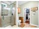 Bathroom featuring a glass shower stall and an adjacent walk-in closet at 1064 Blackbear Dr, Edisto Island, SC 29438