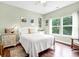 Bright bedroom with hardwood floors, a ceiling fan, and large windows at 1064 Blackbear Dr, Edisto Island, SC 29438