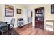 Comfortable bedroom featuring warm wood floors, bright walls, and a workspace area at 1064 Blackbear Dr, Edisto Island, SC 29438