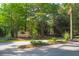 Edisto Oaks community entrance sign with a backdrop of lush green trees at 1064 Blackbear Dr, Edisto Island, SC 29438