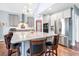 A stylish kitchen featuring gray cabinets, stainless steel appliances, and a spacious granite countertop island at 1064 Blackbear Dr, Edisto Island, SC 29438