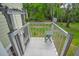 A chair lift and deck overlook a backyard and wooded area at 1064 Blackbear Dr, Edisto Island, SC 29438